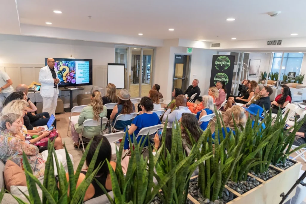Dr. Sal presenting a gut-health talk to a seated audience